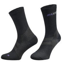 Load image into Gallery viewer, A pair of black Merino Wool Edition by ZaTech® socks on white background. Front left angle.
