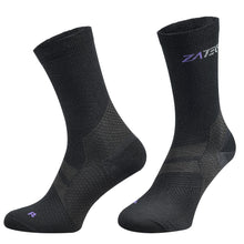 Load image into Gallery viewer, A pair of black Merino Wool Edition by ZaTech® socks on white background. Front left angle.