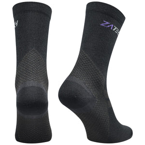 A pair of black Merino Wool Edition by ZaTech® socks on white background. Back left angle.